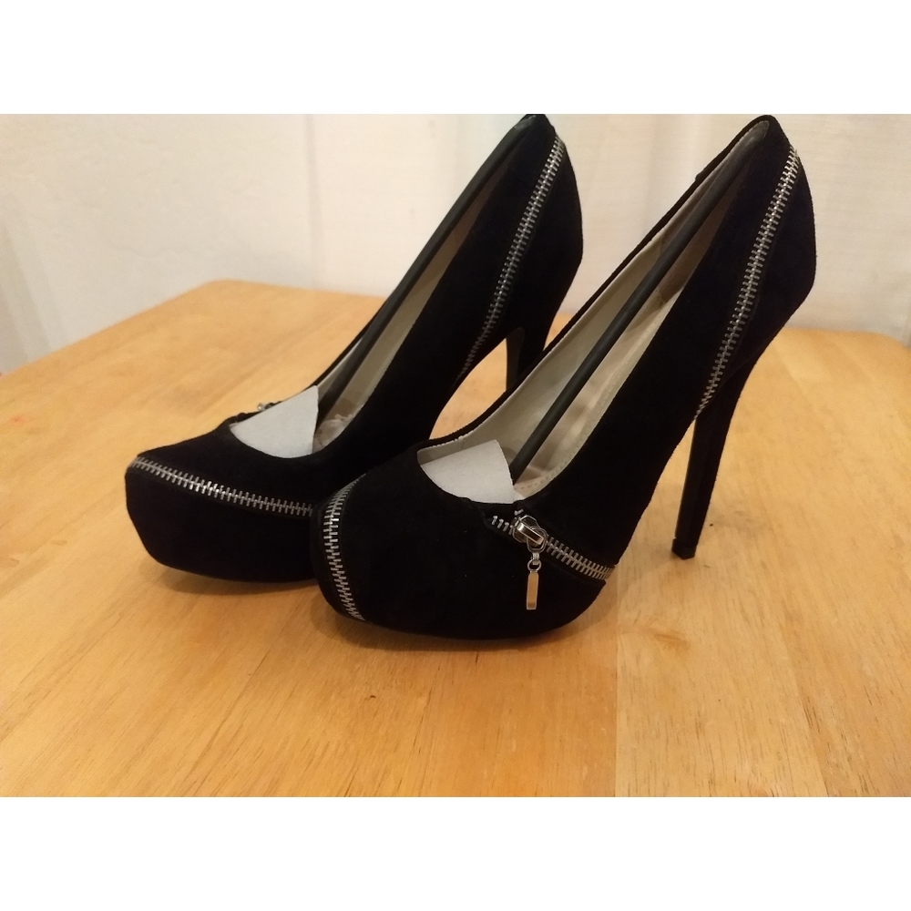 Colin Stuart. Black suede pumps.
